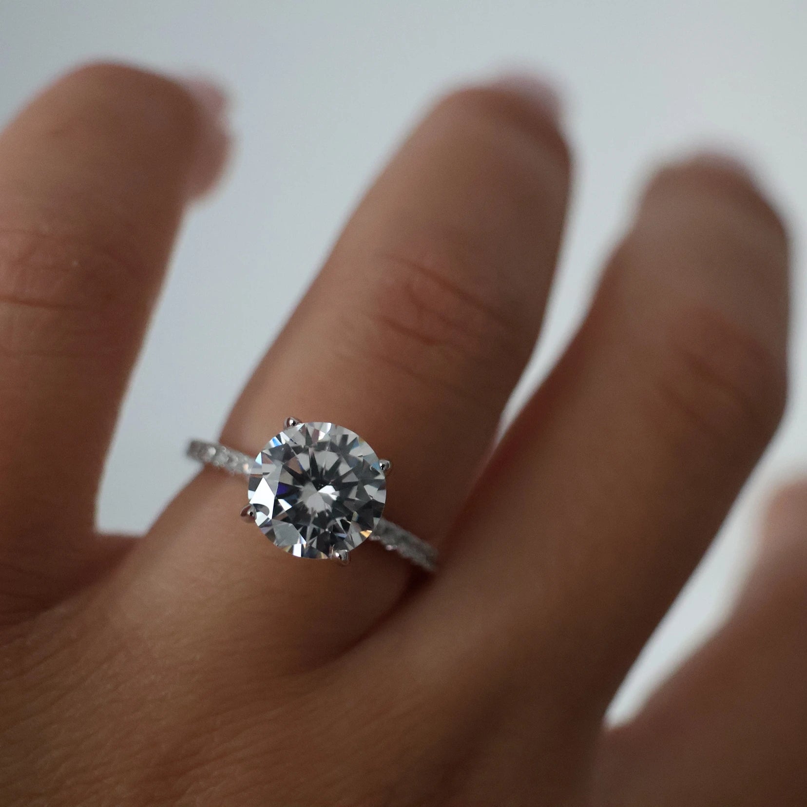 3 carat round cut cubic zirconia ring with pavé band in silver