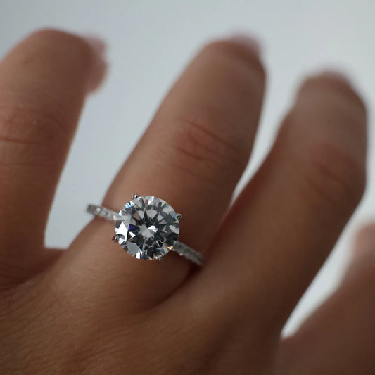 3 carat round cut cubic zirconia ring with pavé band in silver