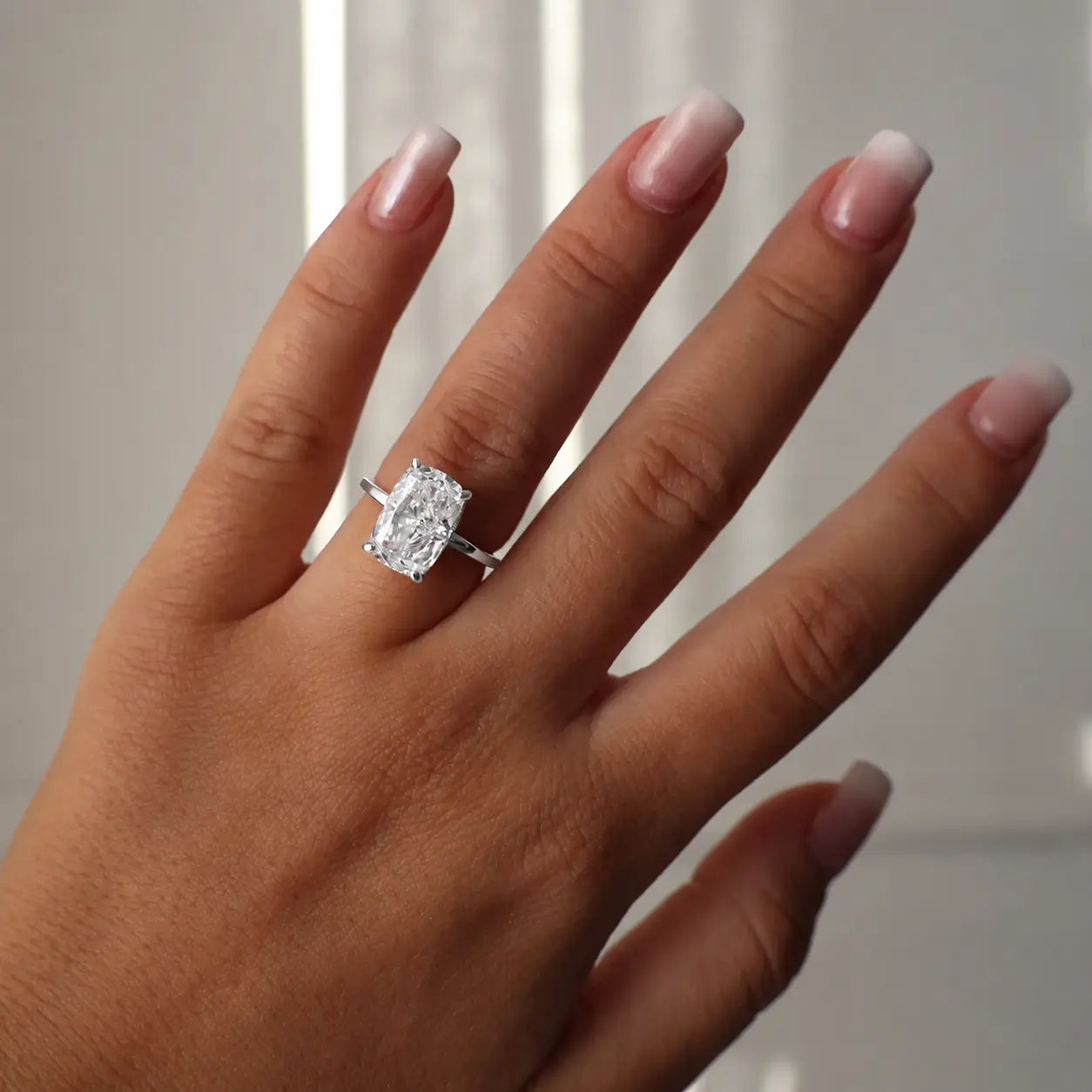 3.5 ct elongated cushion cut cz engagement ring in silver with hidden halo