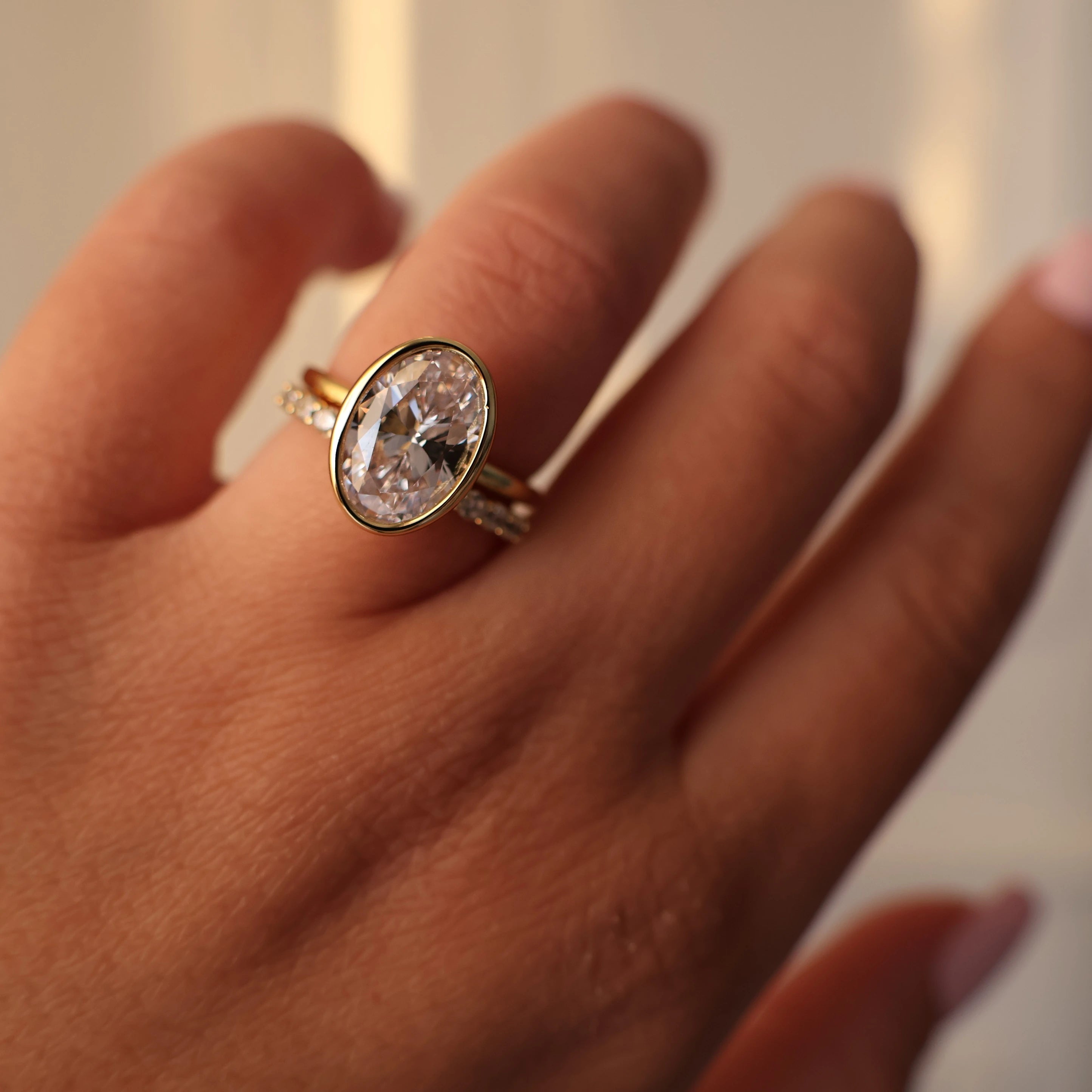 3.5 carat oval bezel set ring with 14K gold plating