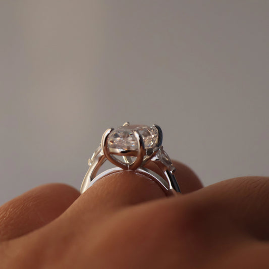 3.5 carat three stone oval trilogy ring with pear side stones silver