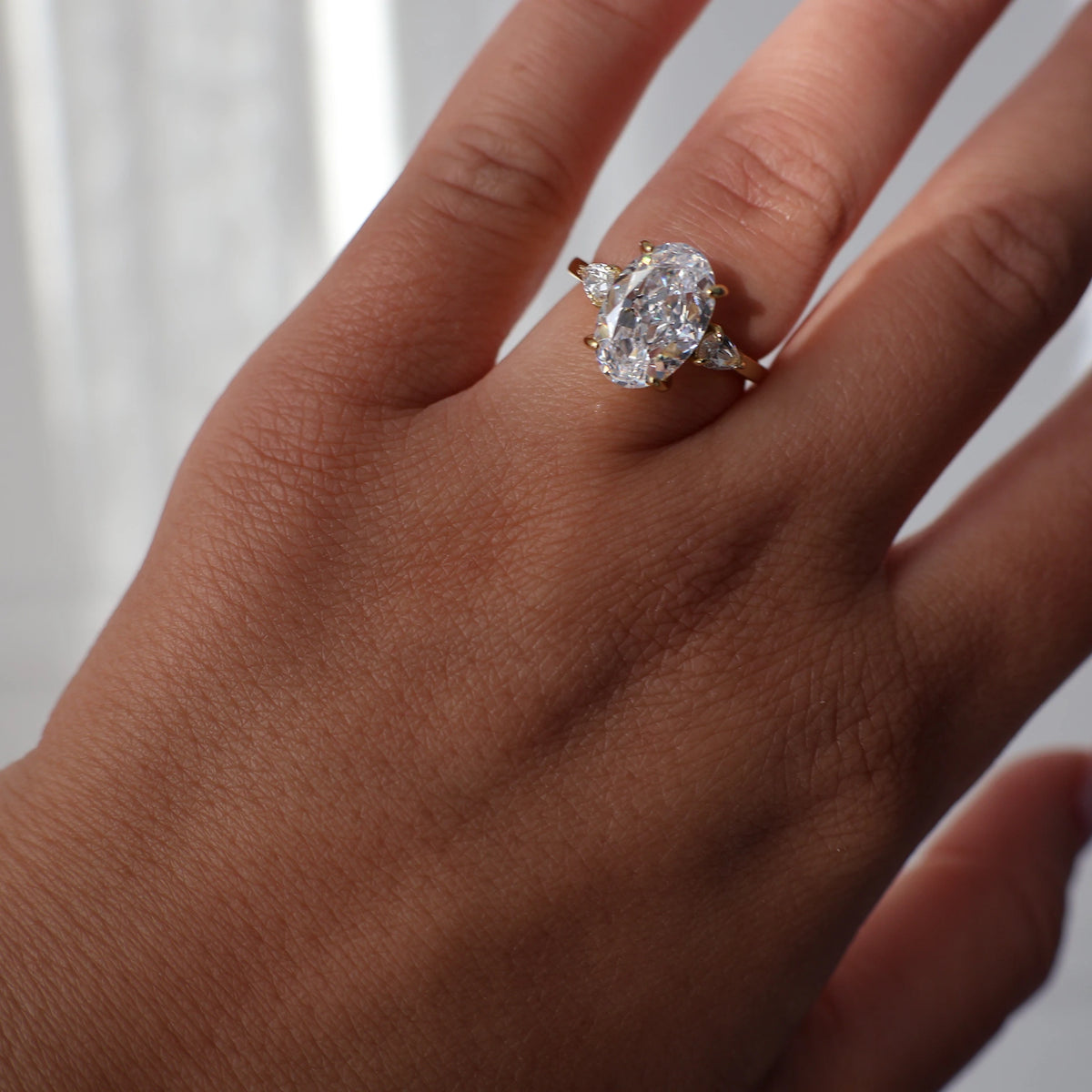 3.5 ct oval cubic zirconia trilogy ring with 14K gold plating