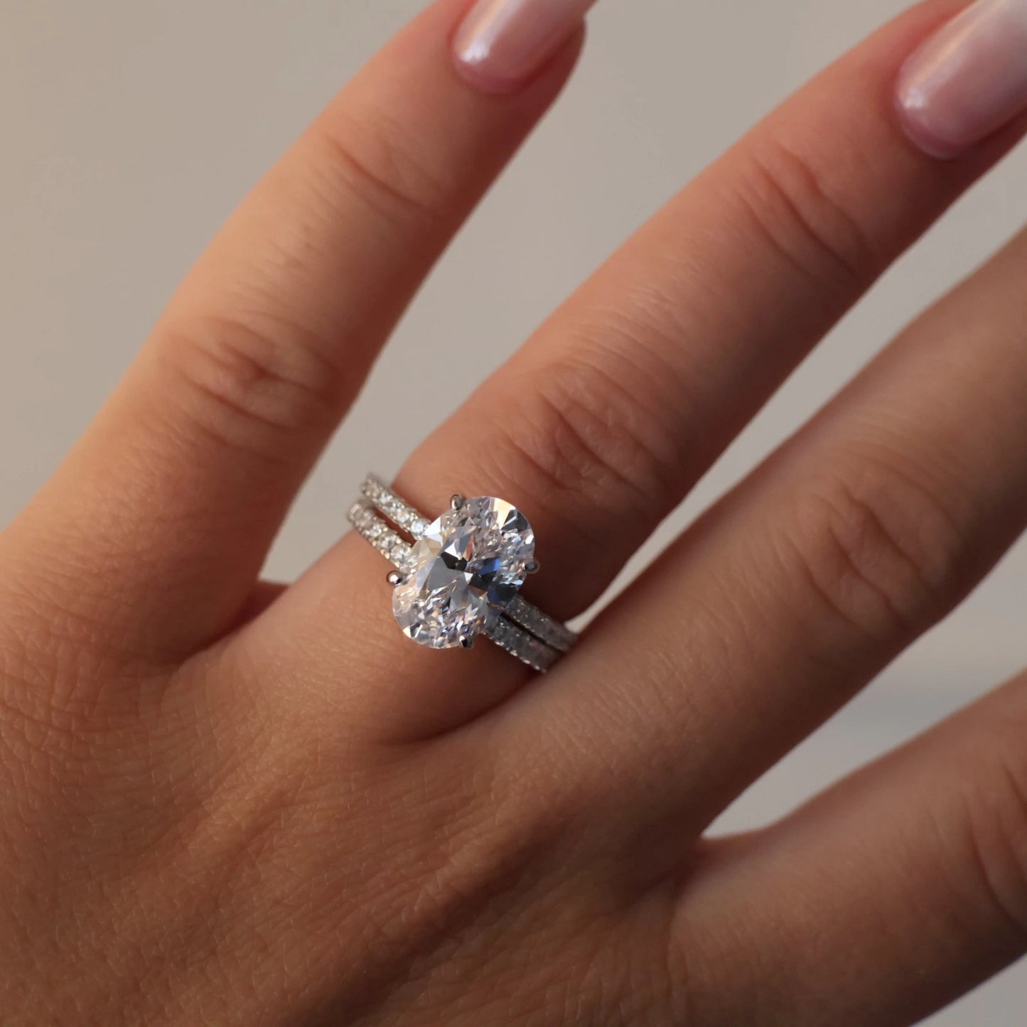 3.5 carat oval cubic zirconia hidden halo ring with pavé band stack in silver