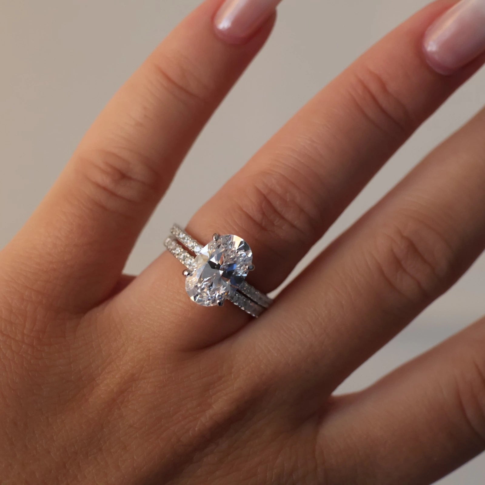 3.5 carat oval cubic zirconia hidden halo ring with pavé band stack in silver