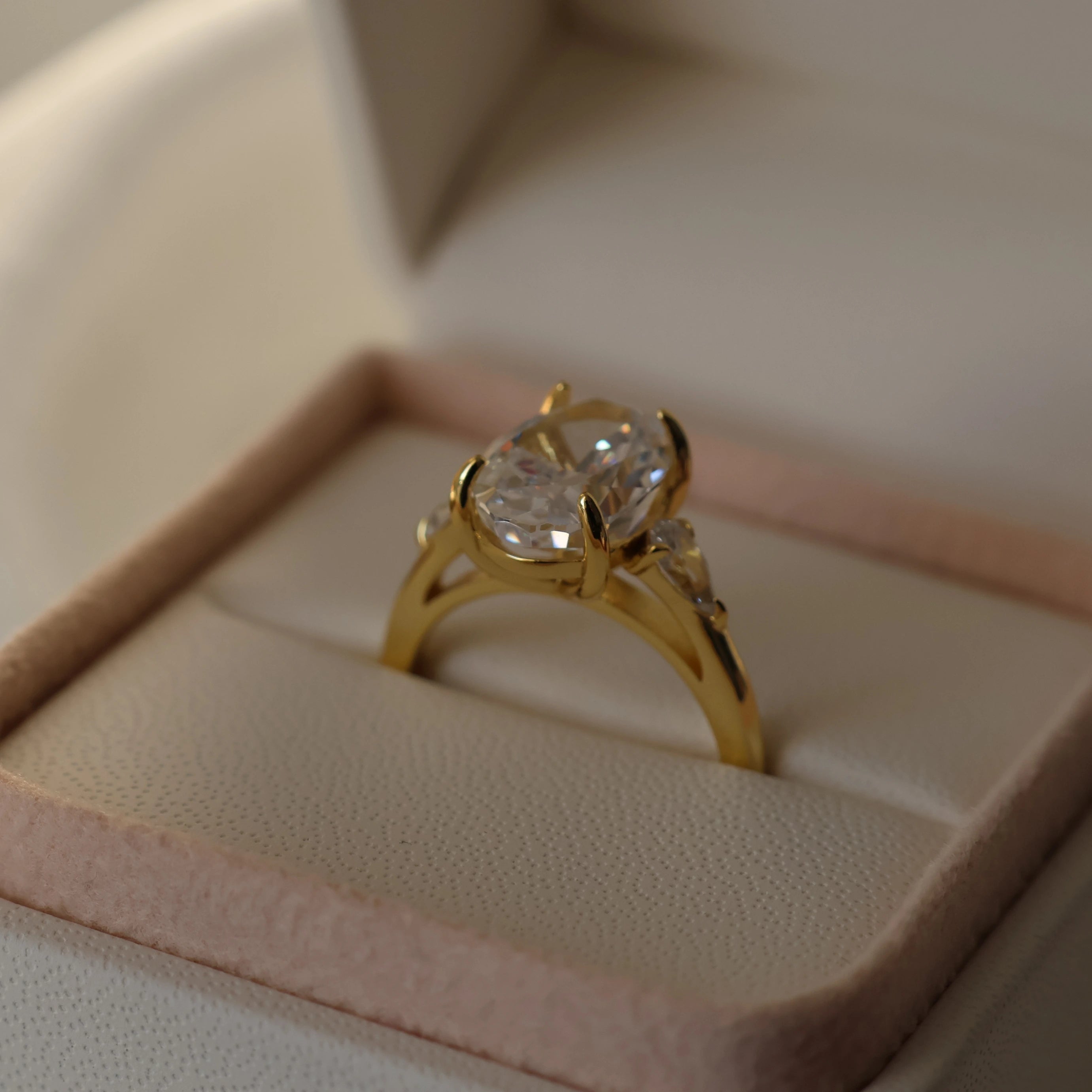 3.5 ct oval trilogy engagement ring with pear shaped cubic zirconia side stones