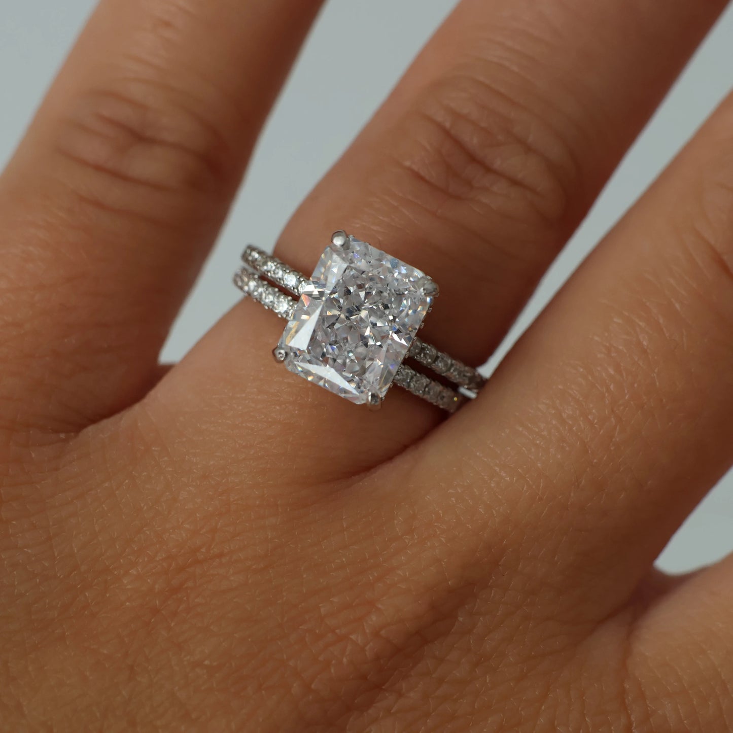 3.5 ct radiant cut cubic zirconia ring with a pavé band in silver