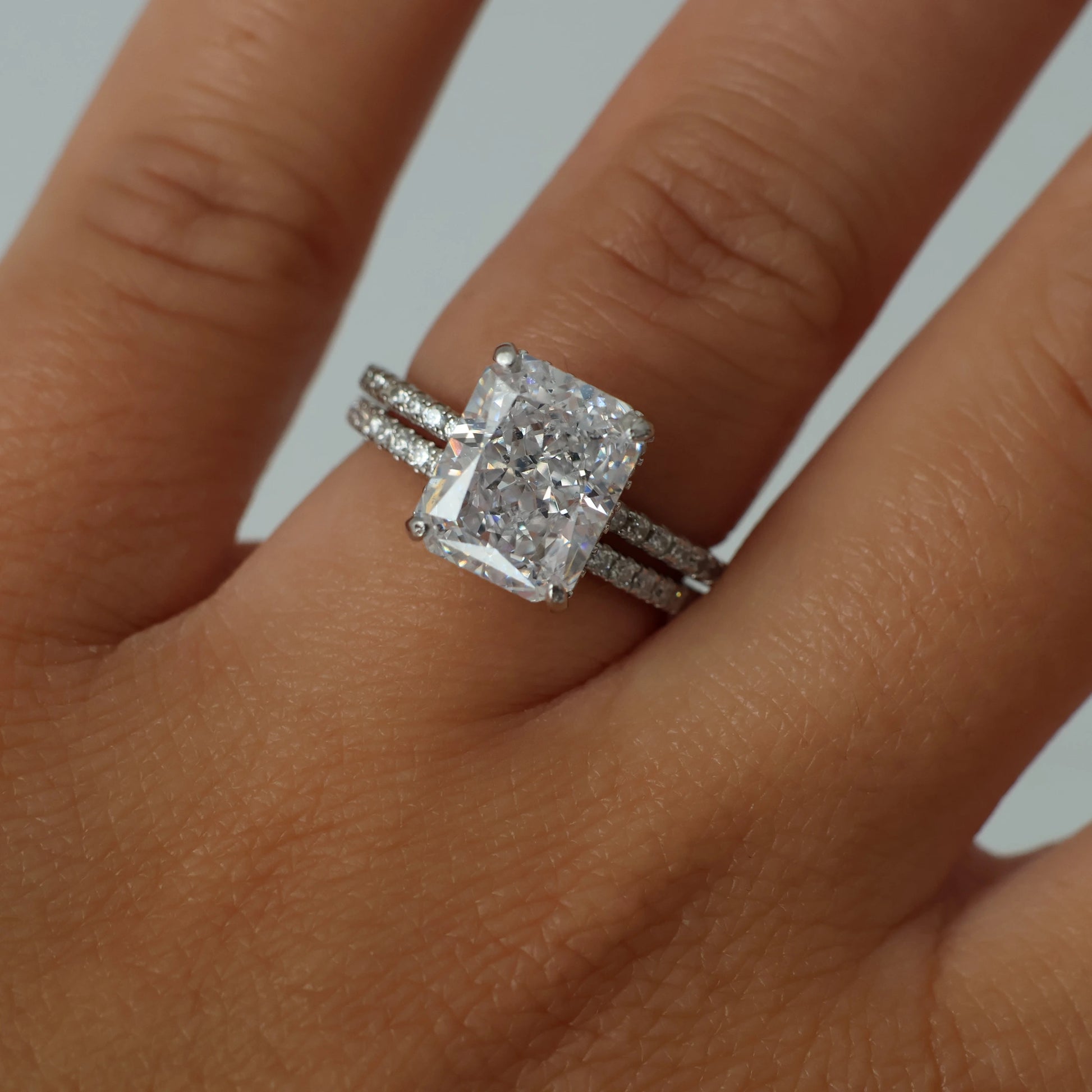 3.5 ct radiant cut cubic zirconia ring with a pavé band in silver