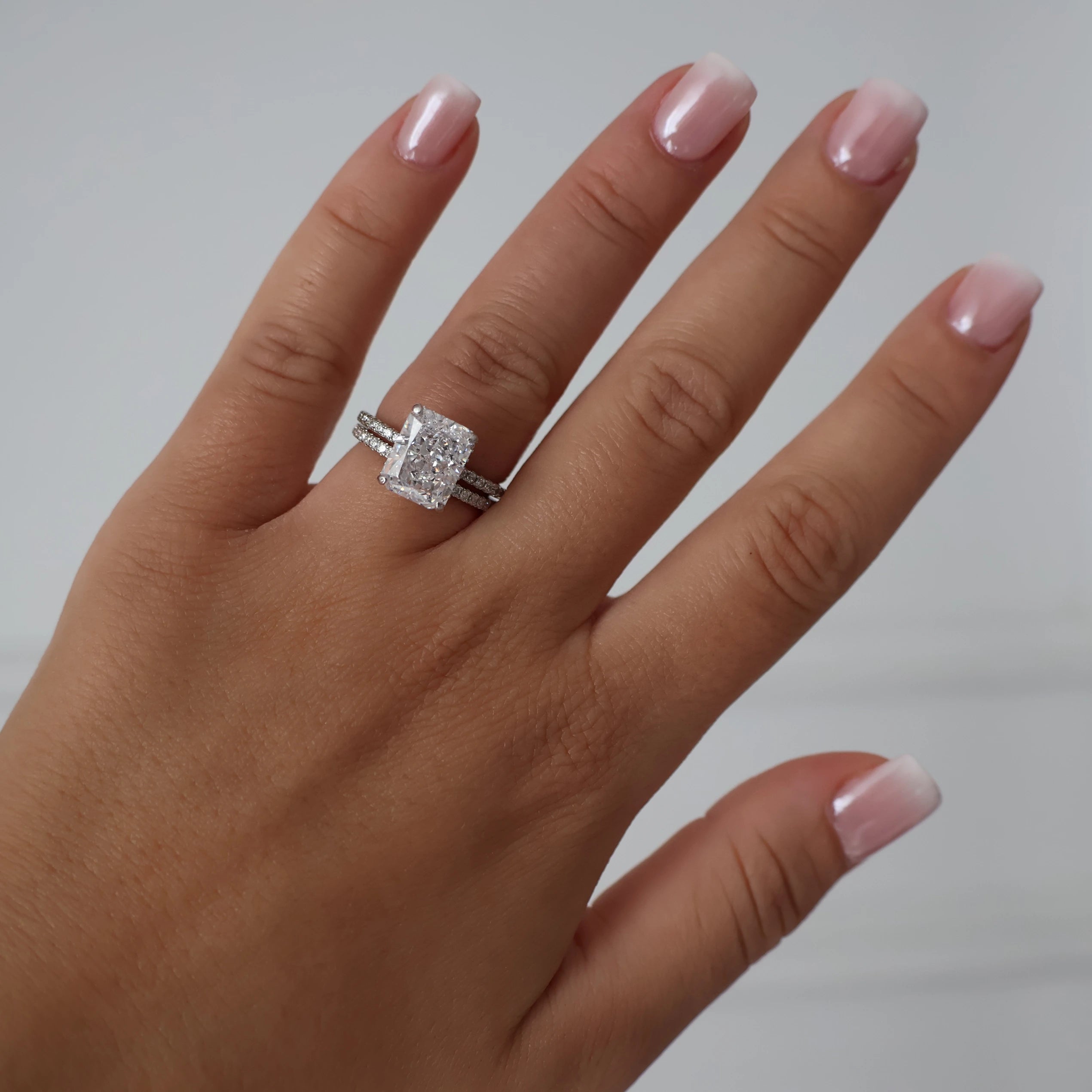 3.5 ct radiant cut cubic zirconia ring with a pavé band in silver