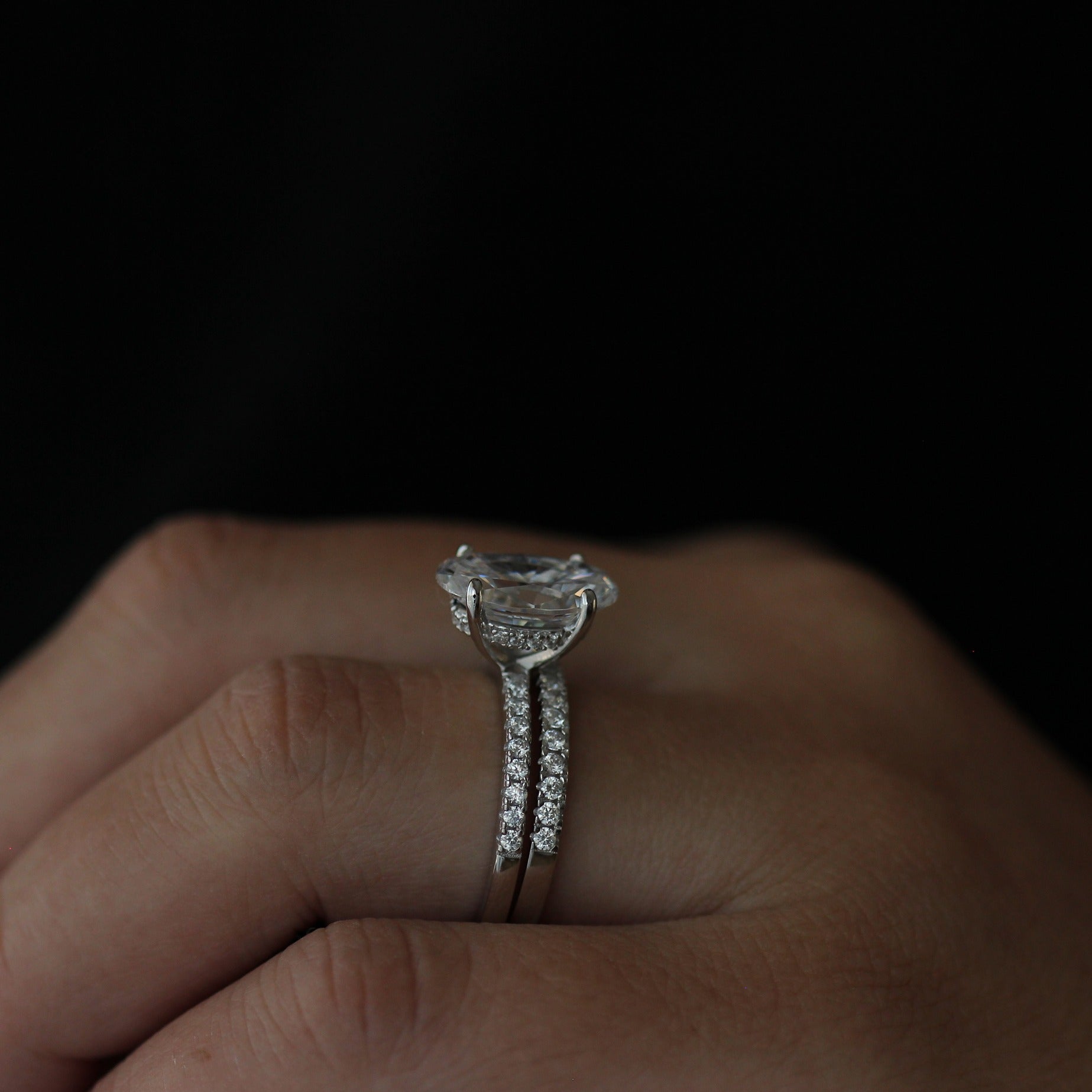 3.5ct oval ring with pave band side view on hand