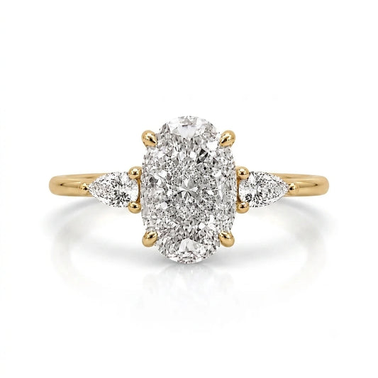 3.5 carat three stone trilogy oval ring with pear side stones in 14k gold plating