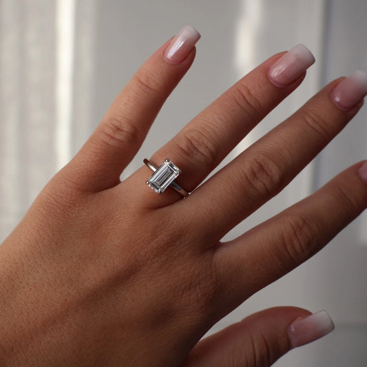 3 carat elongated emerald cut silver solitaire ring