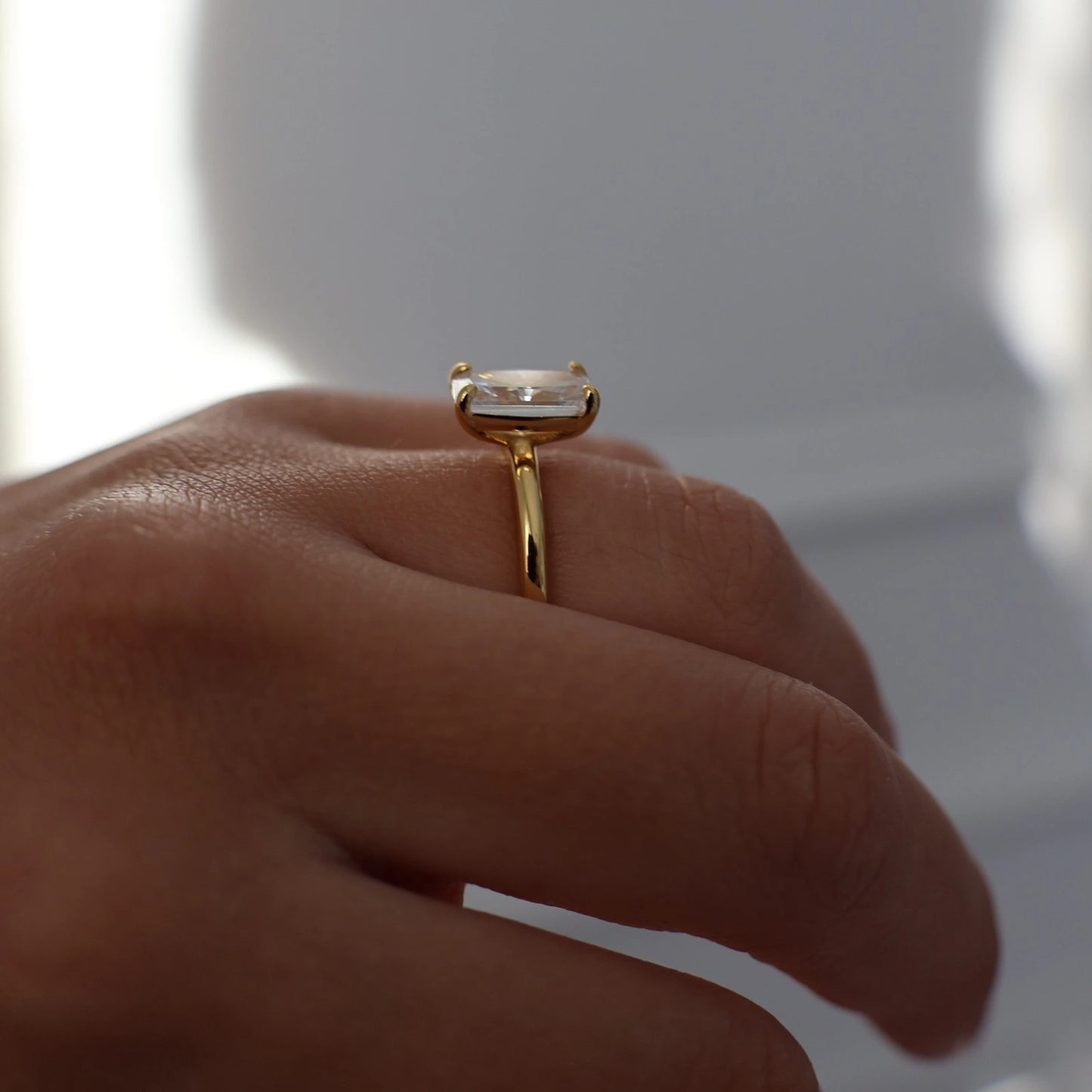 side profile of 3 carat elongated radiant cut ring in gold