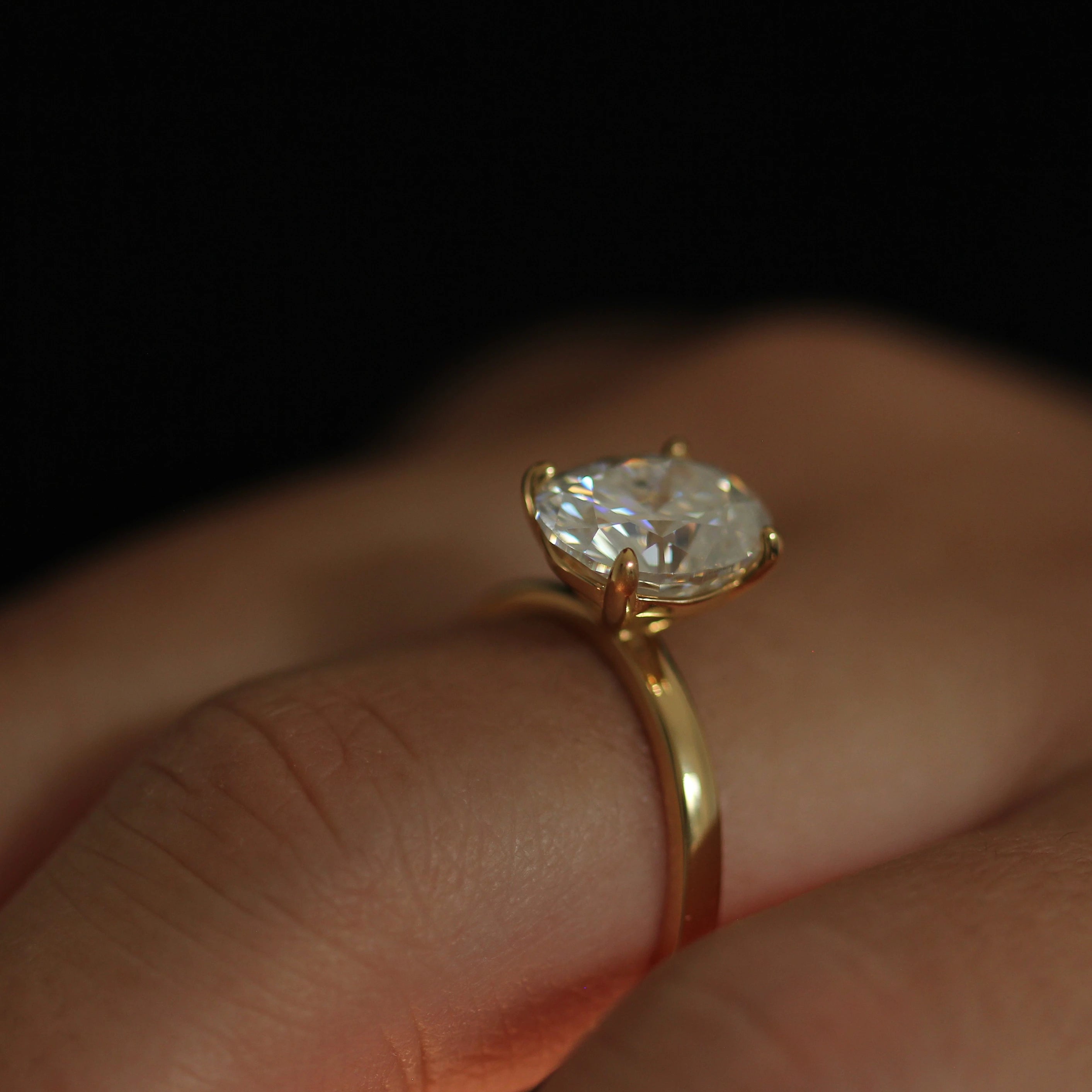 top view of 3 carat elongated oval moissanite ring in 14k gold filled