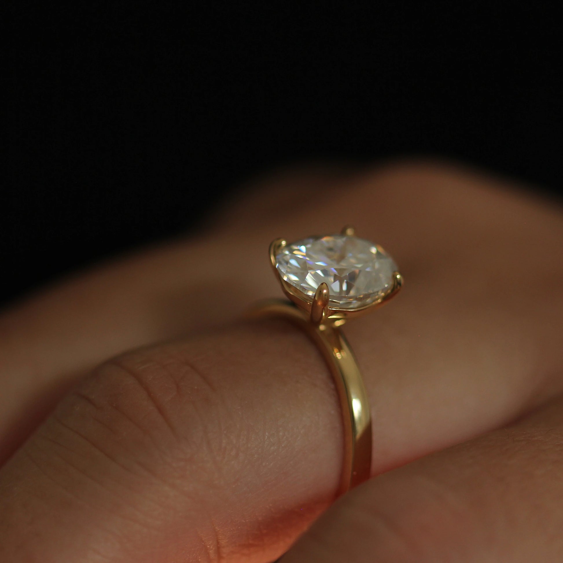 top view of 3 carat elongated oval moissanite ring in 14k gold filled