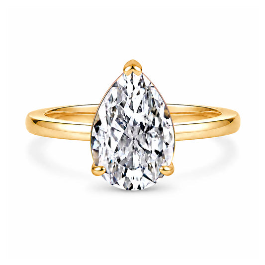 3 carat pear cut cubic zirconia solitaire ring in gold on a white background