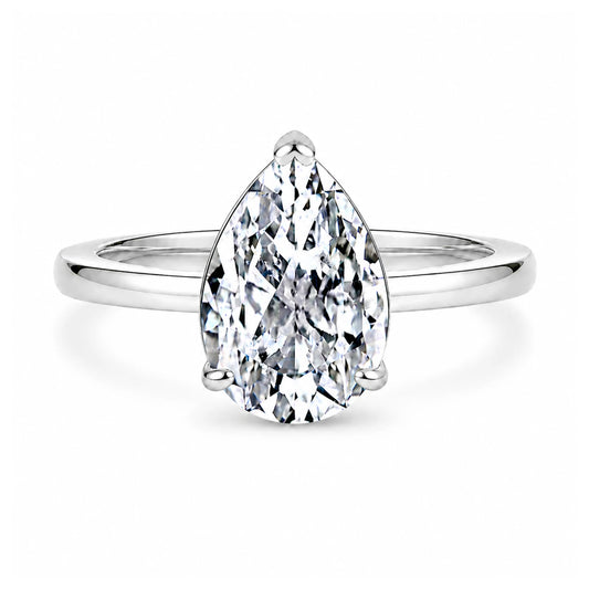 3 carat pear cut cubic zirconia solitaire ring in silver on a white background