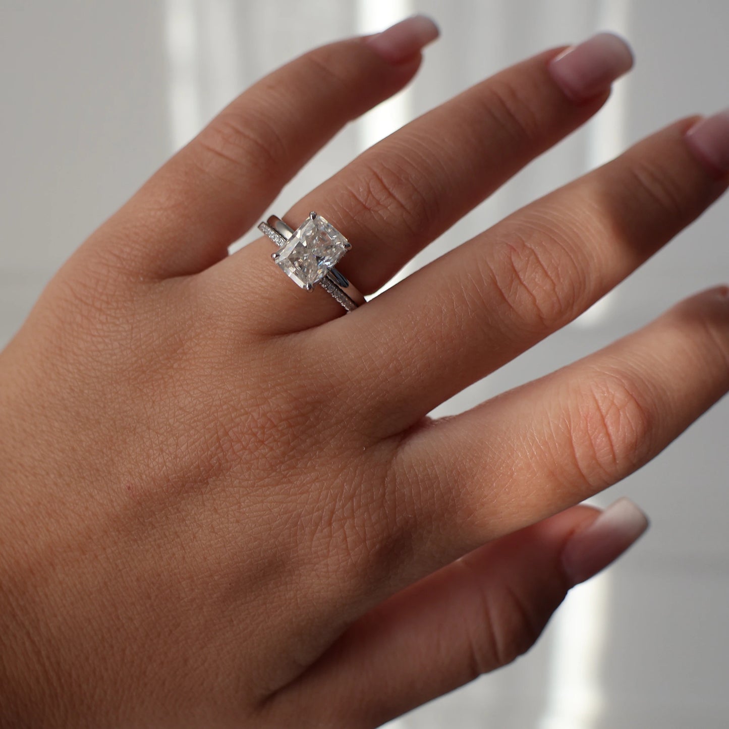 3 carat moissanite ring paired with a moissanite eternity band