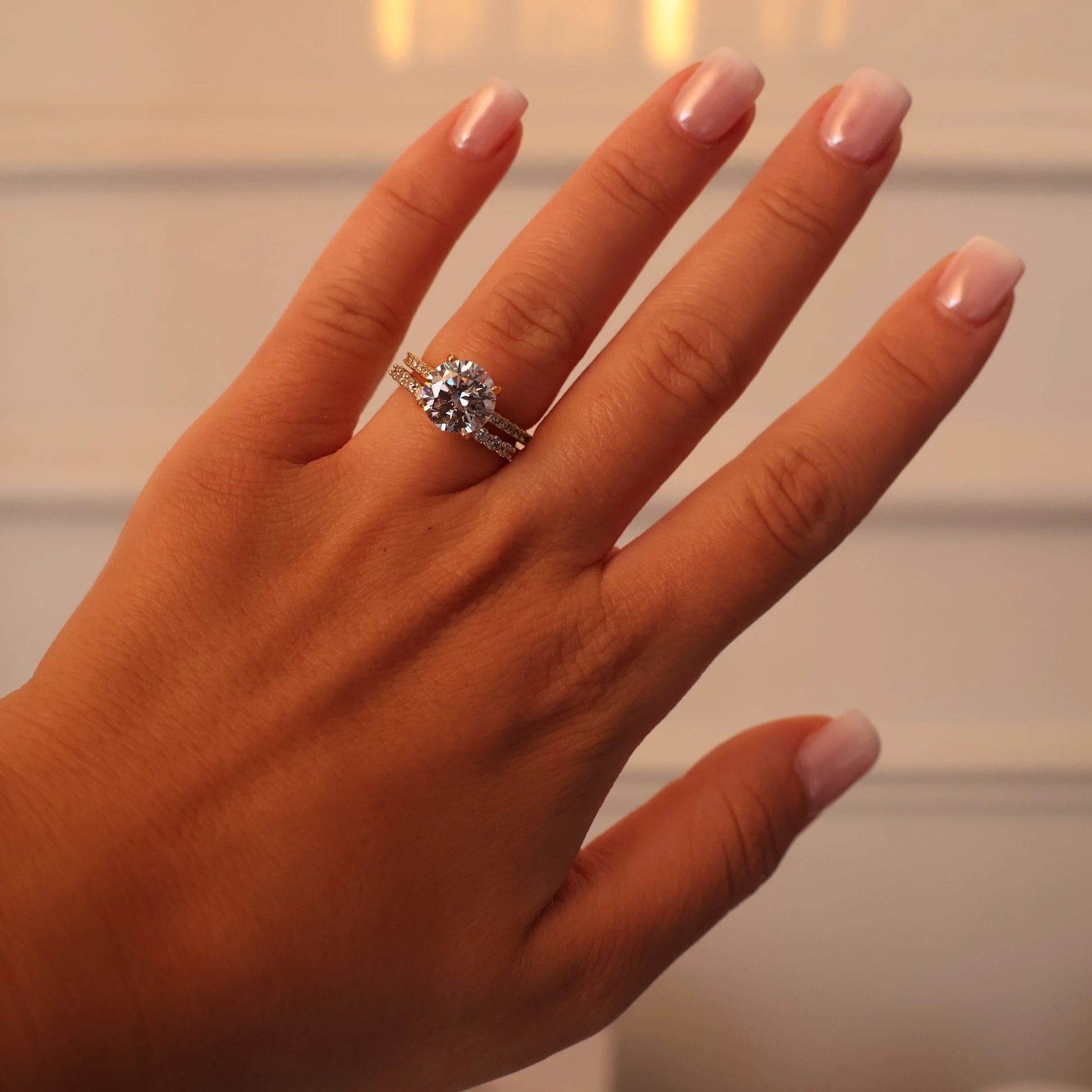 3 ct round cut cubic zirconia pavé ring stacked with a matching pavé wedding band
