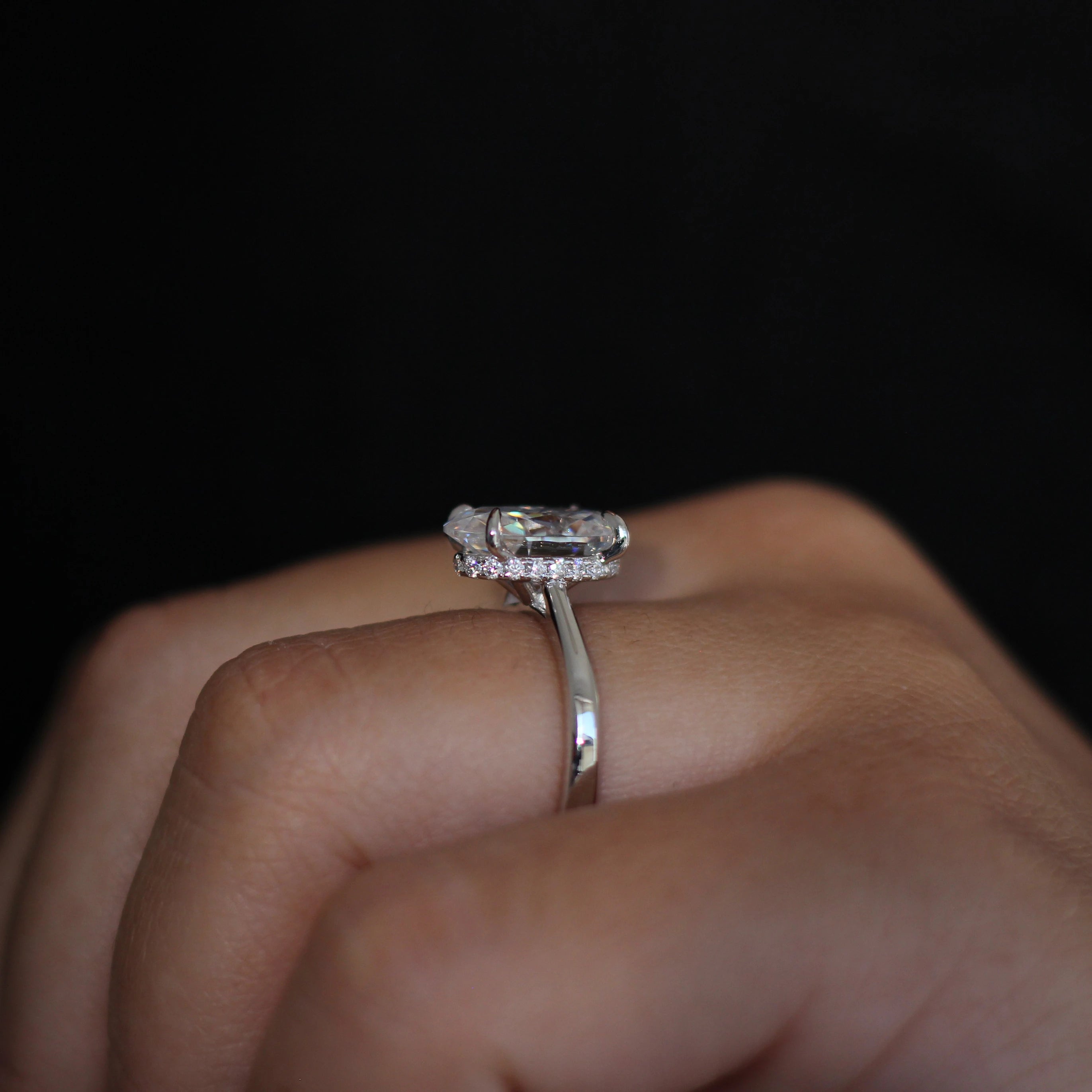 hidden halo close up of 4 carat crushed ice moissanite ring in sterling silver