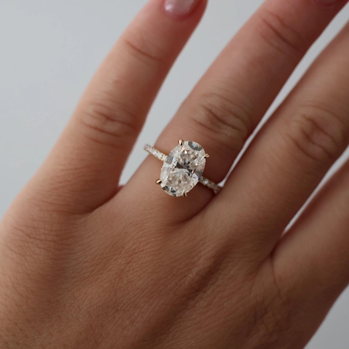 4 carat oval moissanite engagement ring with pave band in 14k gold filled
