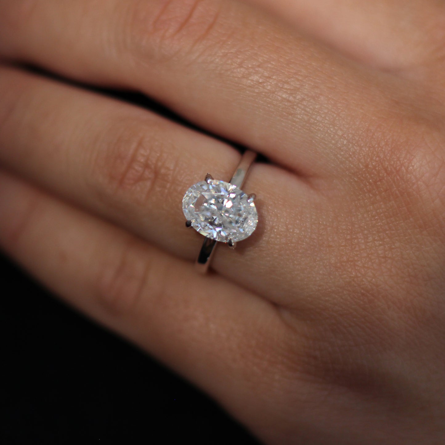4 carat oval crushed ice moissanite engagement ring in silver