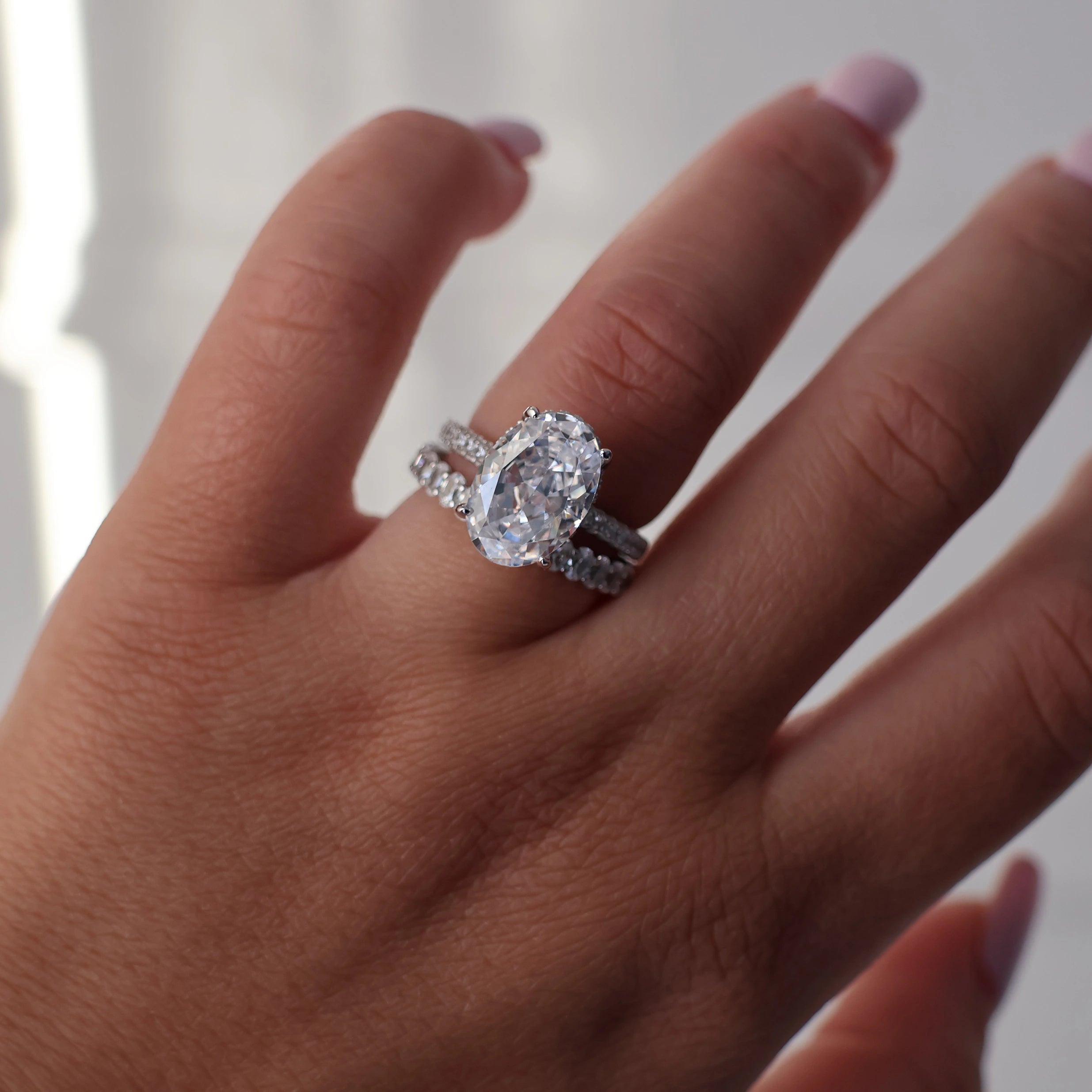 4 carat oval cubic zirconia silver ring with a hidden halo