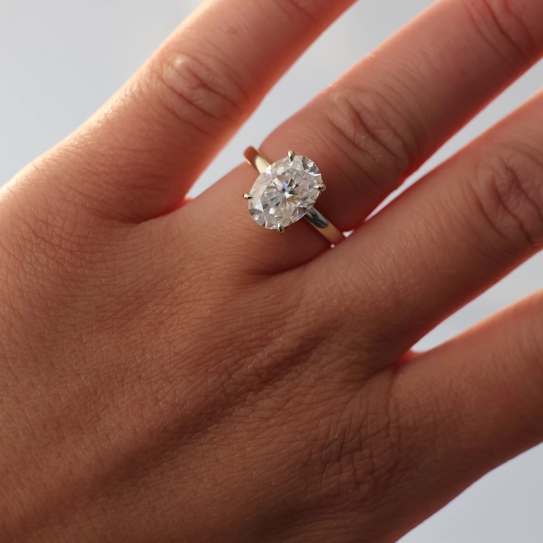 4 carat oval moissanite engagement ring with hidden halo in 14K gold filled