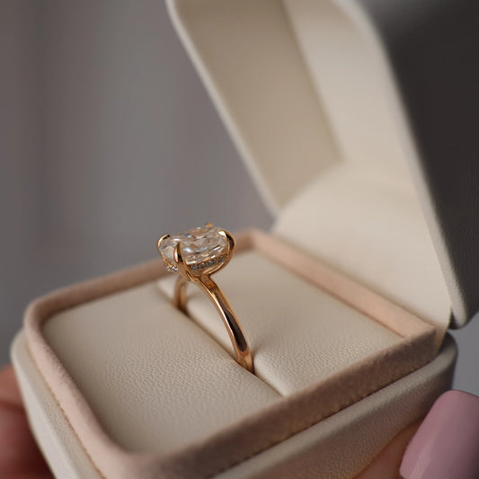 4 carat oval moissanite ring with hidden halo in 14K gold filled presented in a proposal box