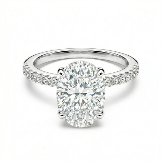 Oval moissanite ring with pave band on white background