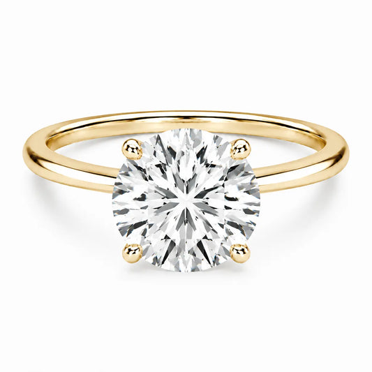 4 carat round cut gold ring on white background