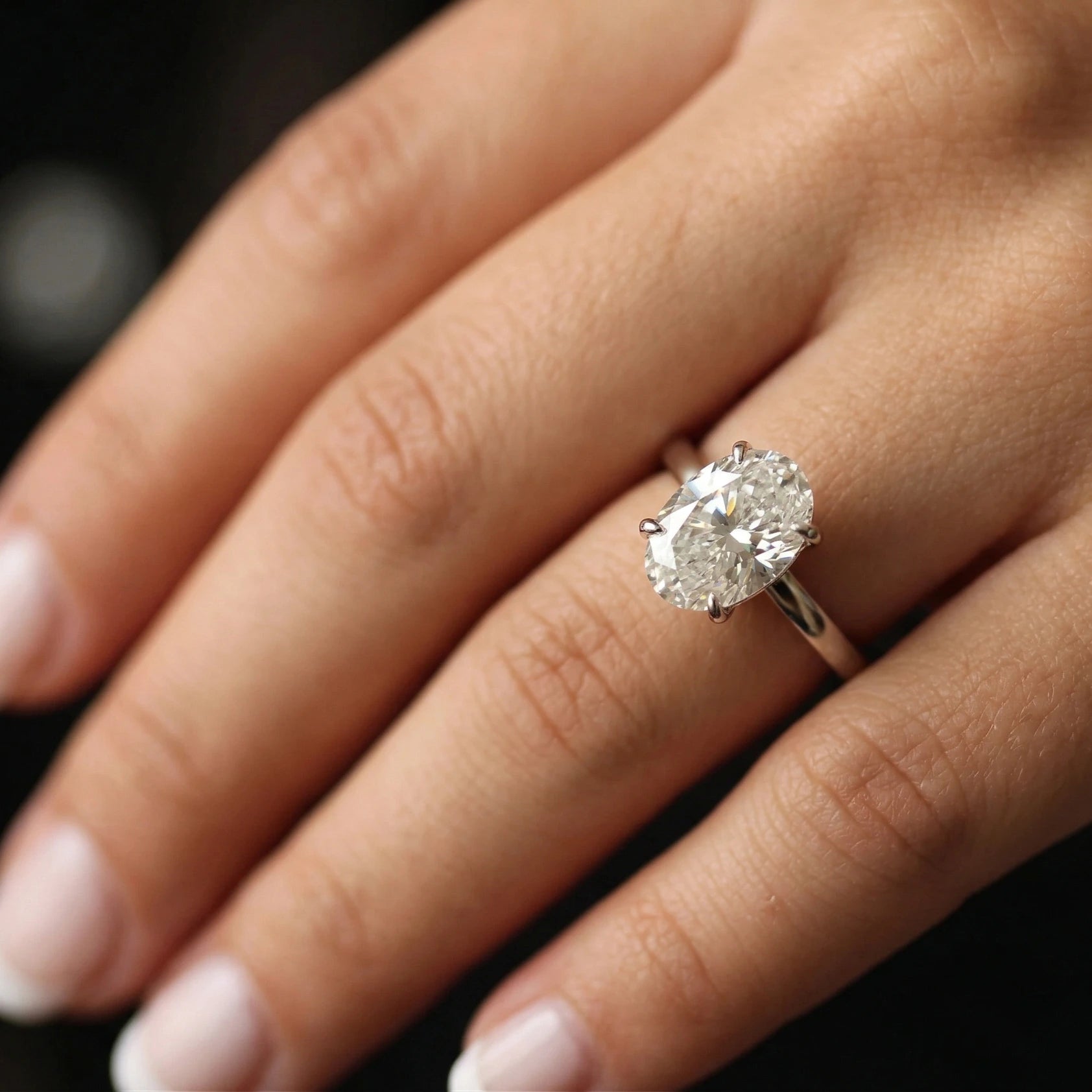 4 carat oval moissanite ring on model's hand