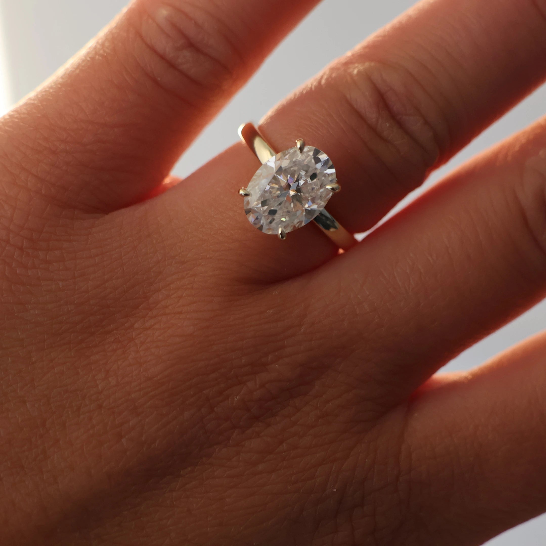 4 carat oval moissanite engagement ring with hidden halo in 14K gold filled
