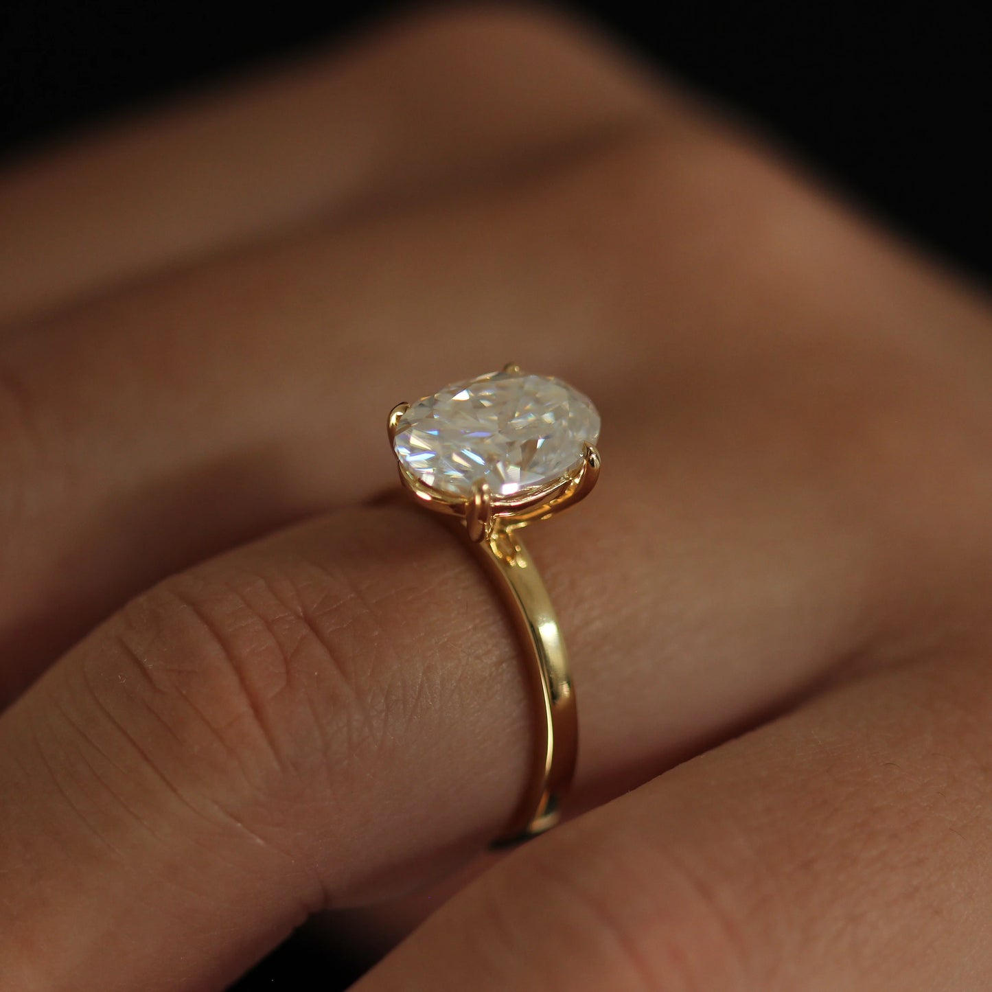 side view of 4 carat elongated oval moissanite ring in 14k gold filled