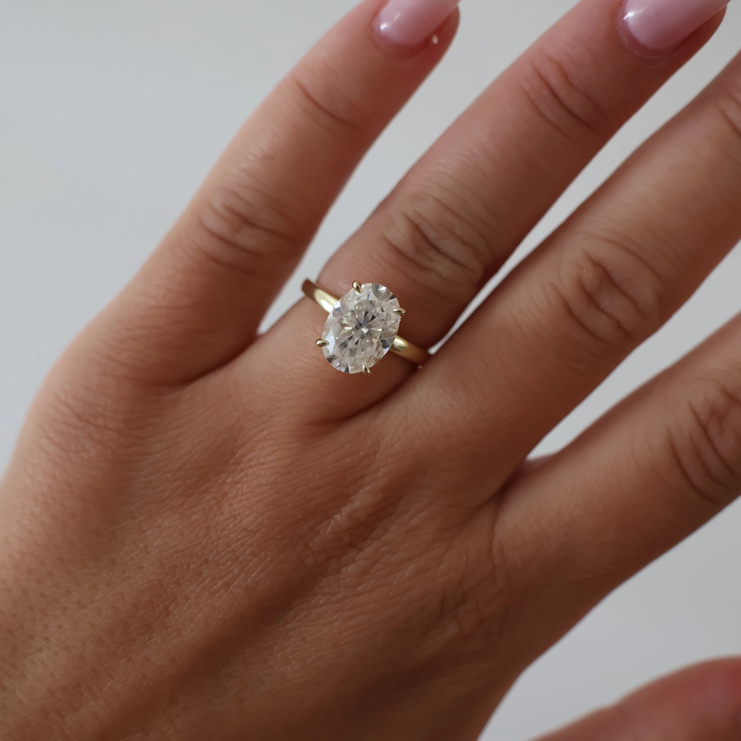 4 carat oval hidden halo moissanite ring in light 18K gold filled