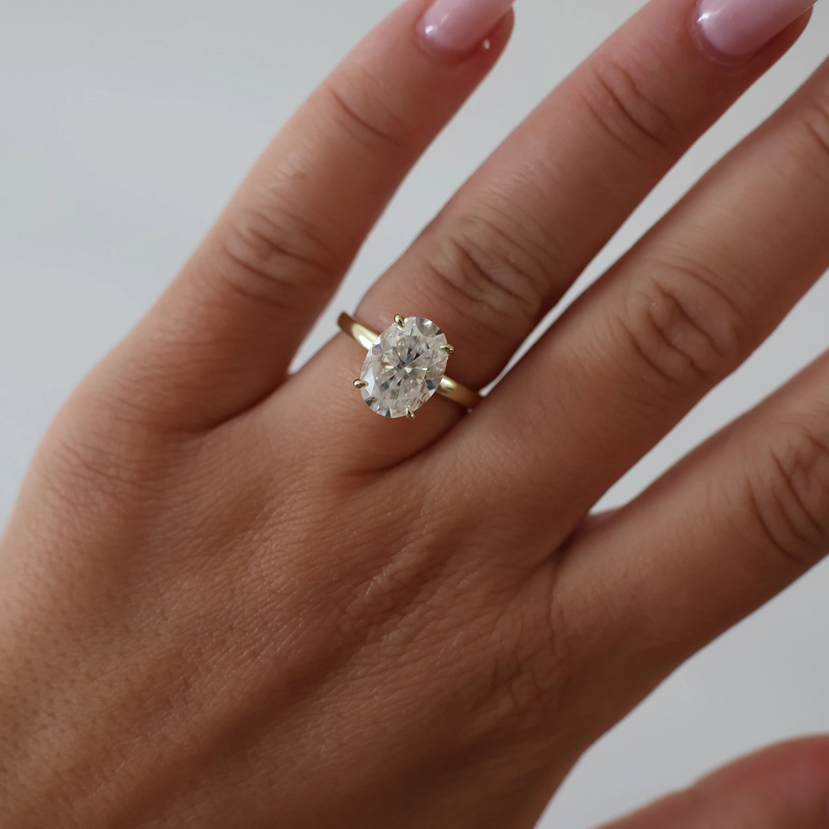 4 carat oval hidden halo moissanite ring in light 18K gold filled