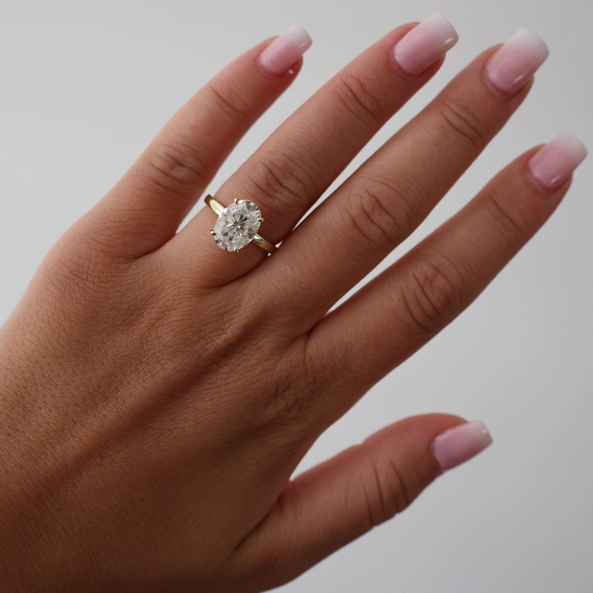 4 carat oval moissanite ring in light 18K gold filled with hidden halo