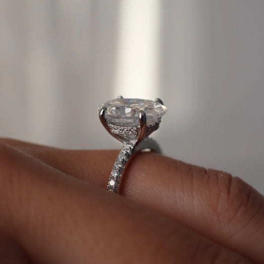4 carat oval moissanite ring in silver with hidden halo and pavé band