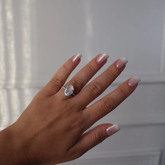 4 carat oval silver ring with pavé band