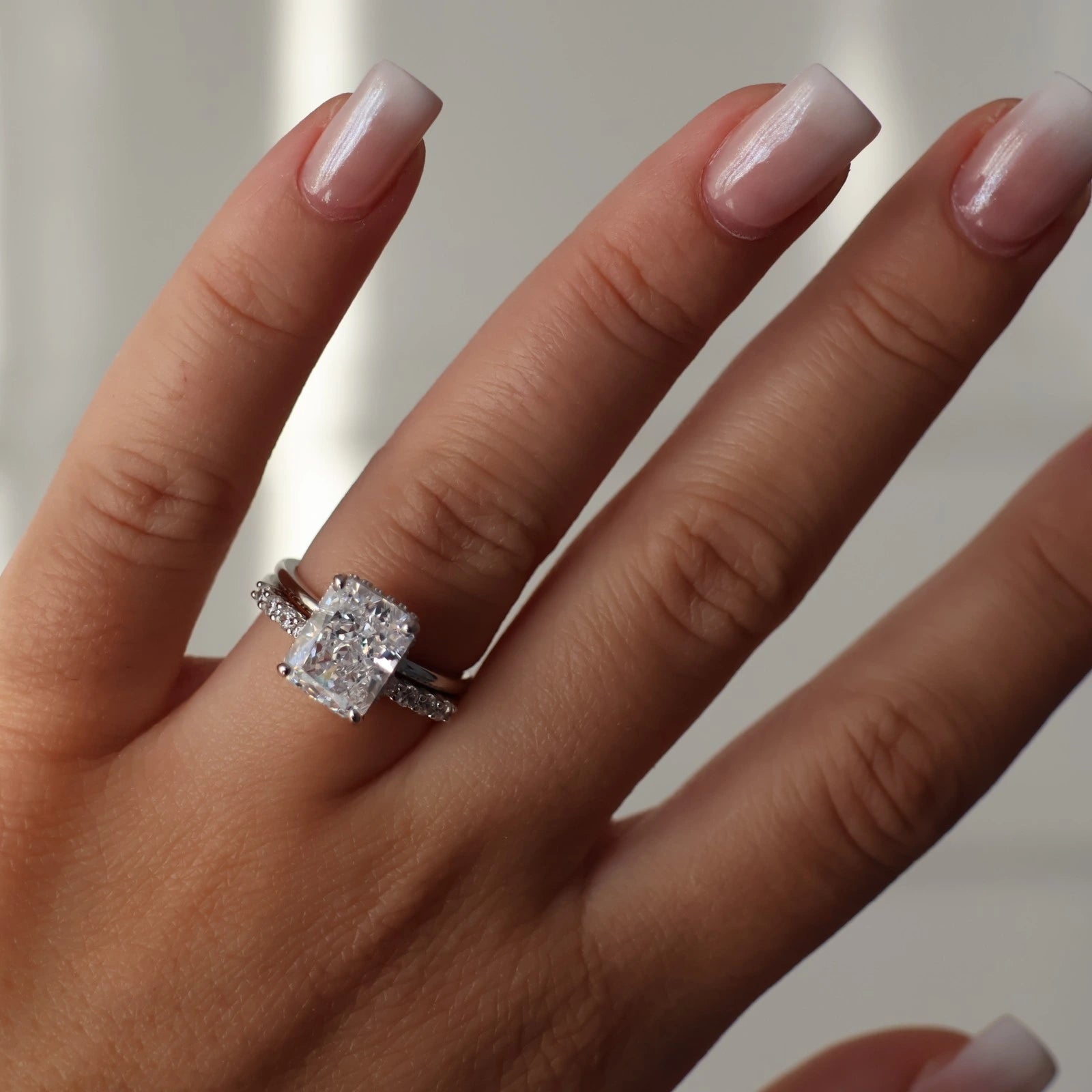 4 carat radiant cut silver ring with hidden halo stacked with wedding band