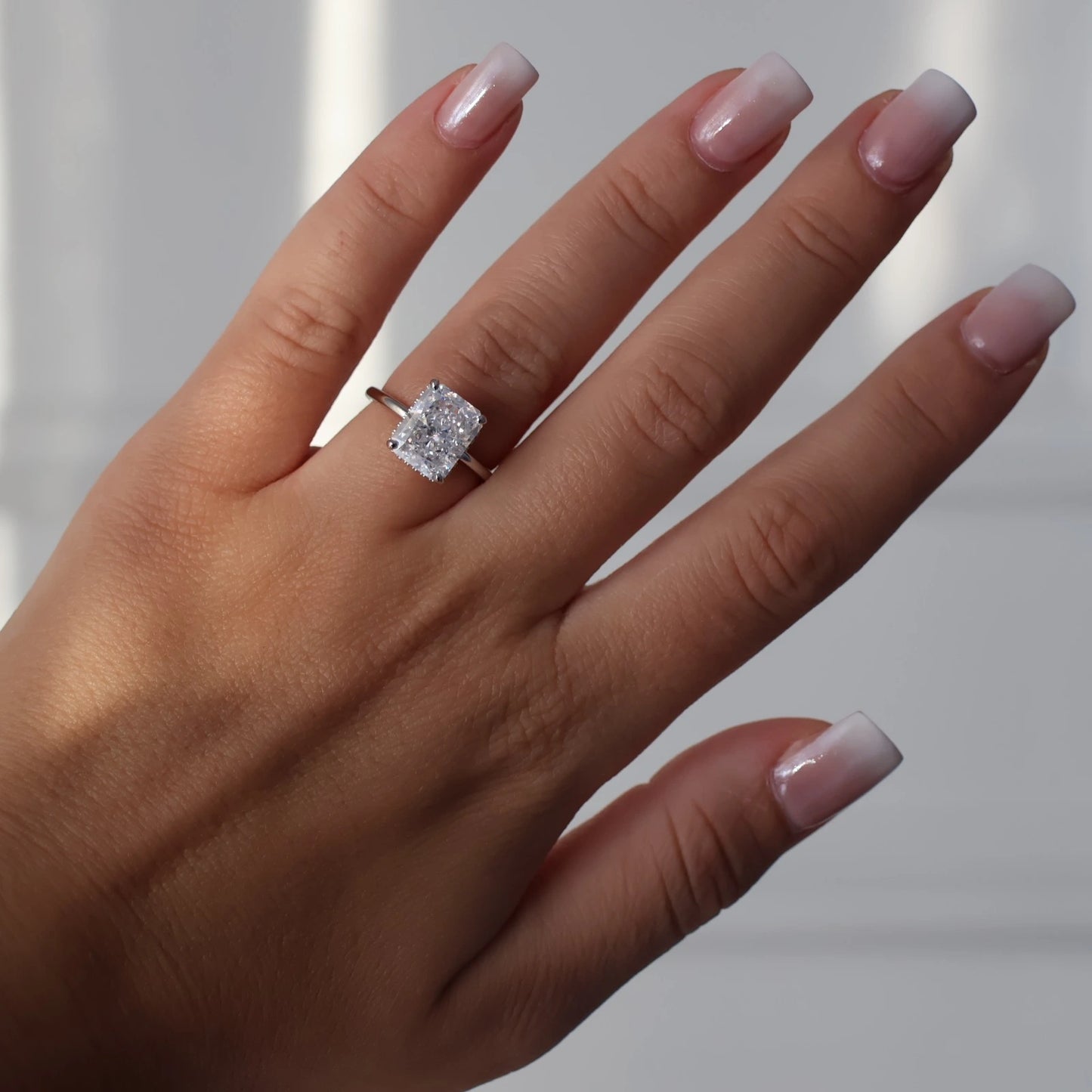 4ct radiant cut ring in silver with hidden halo