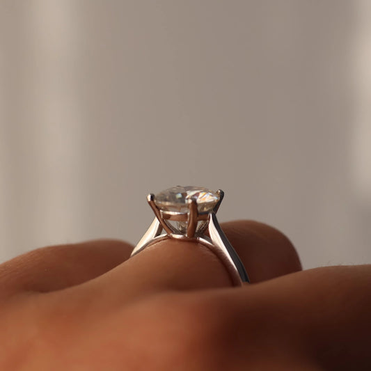 925 sterling silver ring featuring a round moissanite solitaire