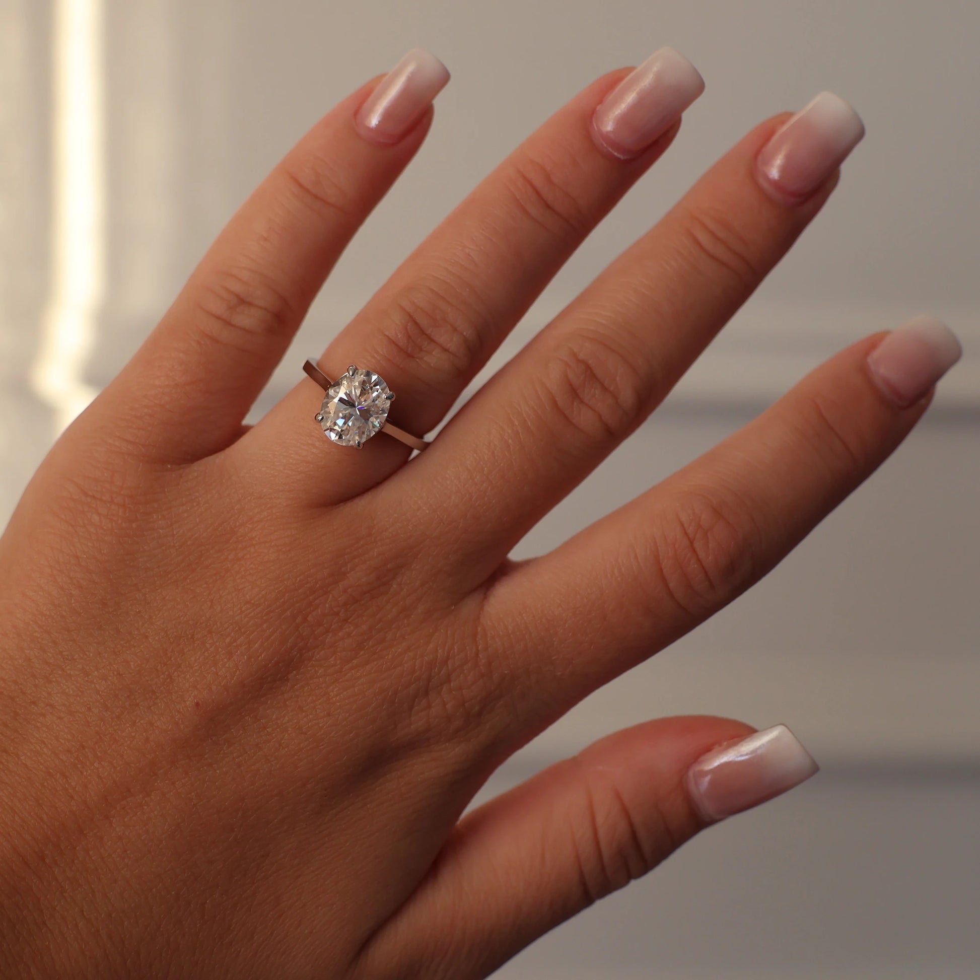 925 sterling silver engagement ring with a 3 carat oval moissanite
