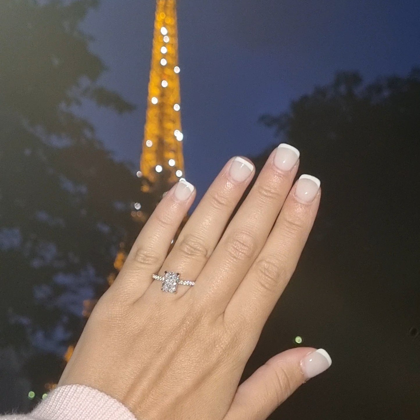 2 ct Radiant cut ring on hand in front of Eiffel Tower