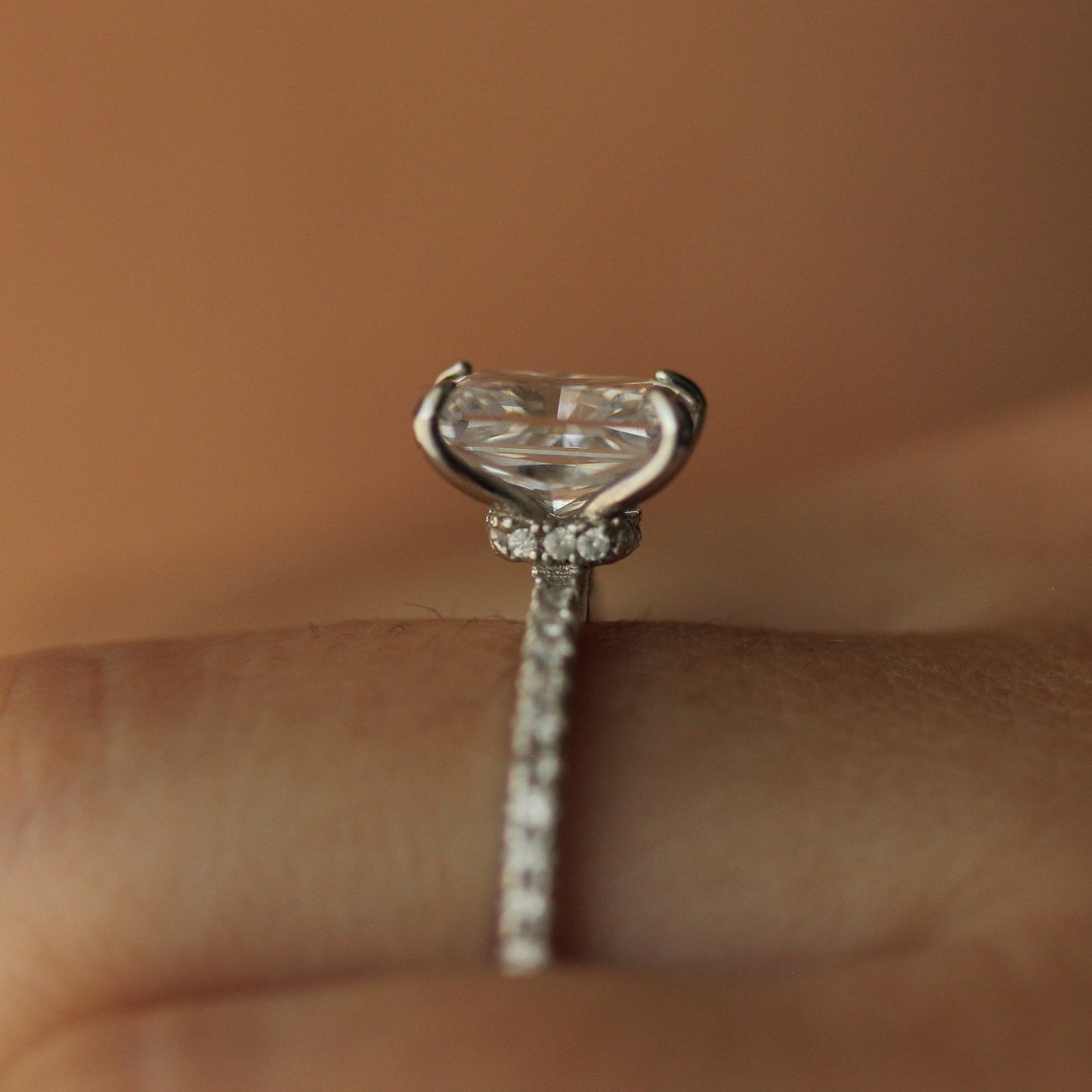 Side profile of radiant cut ring on hand