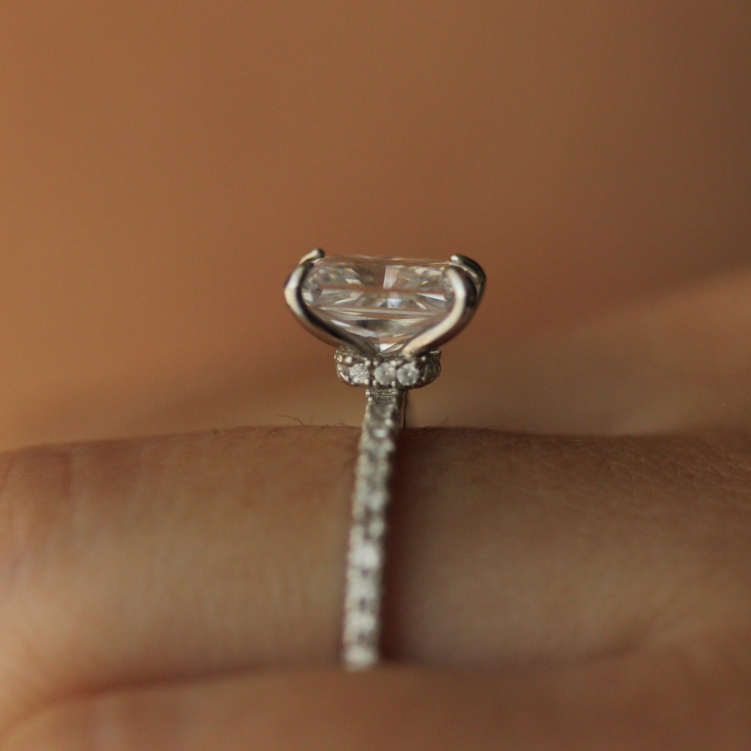 Side profile of radiant cut ring on hand