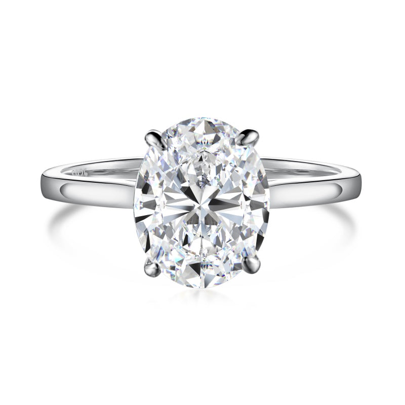 3 carat oval moissanite ring on silver band on plain white background