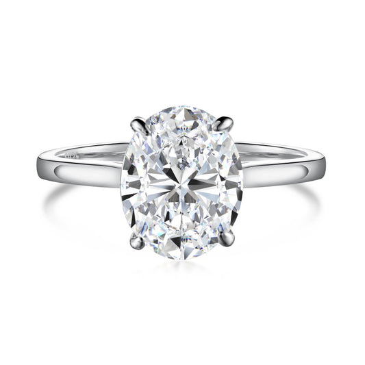3 carat oval moissanite ring on silver band on plain white background
