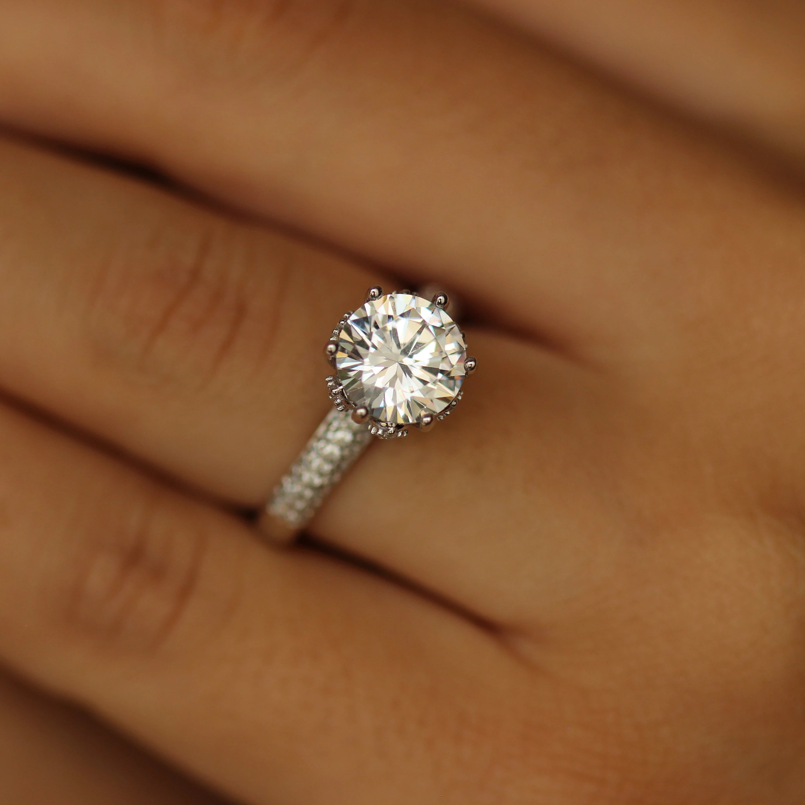 round stone on silver band with tiny cz stones on it