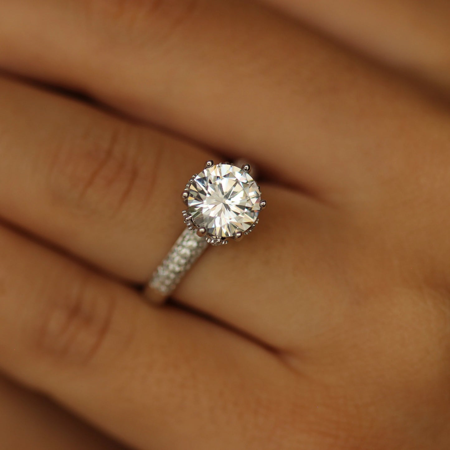 round stone on silver band with tiny cz stones on it