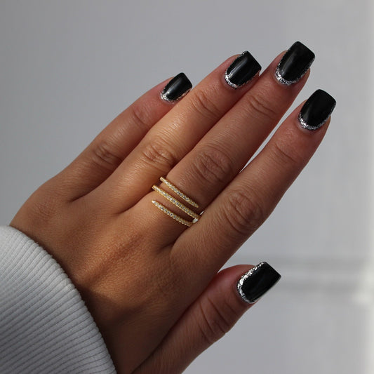 Gold spiral ring on hand